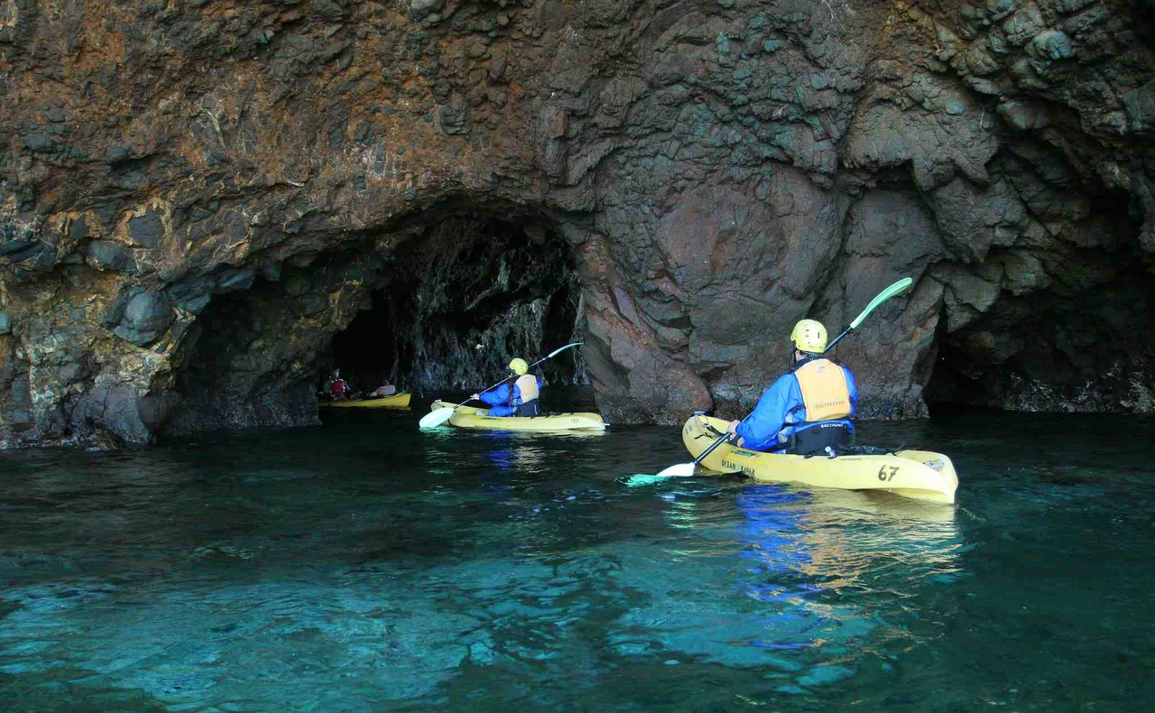 Participate in rowing through crystal clear waters and exploring hidden sea caves