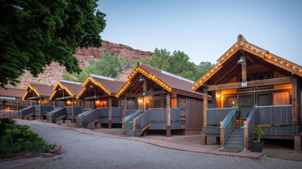 Moab Springs Ranch provides cozy cottages and townhomes surrounded by lush gardens and stunning red rock formations.