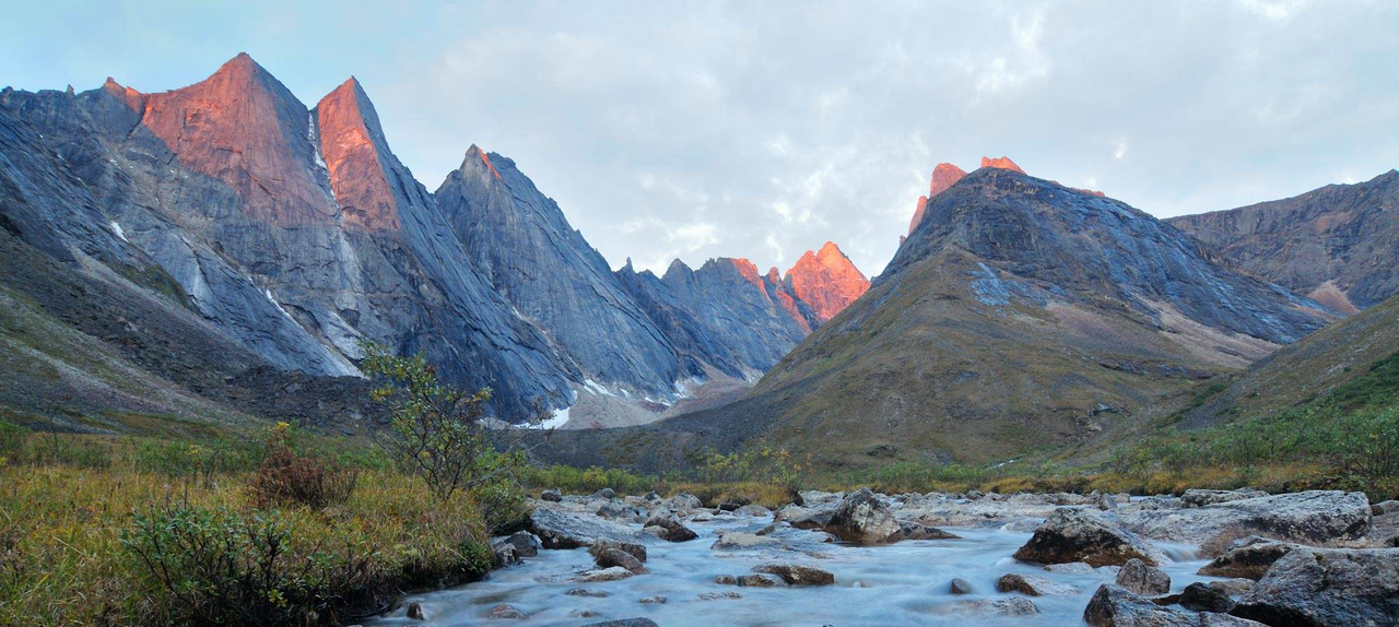 The best time to visit Gates of the Arctic is during the summer months when the weather is milder and the days are long. Access to Gates of the Arctic is limited and primarily by small aircraft or bush planes. Plan your transportation to ensure a smooth journey.
Visiting Time
The best time to visit Gates of the Arctic National Park is during the summer months, typically from late June to early September. During this time, the weather is milder, and the days are longer, allowing for more outdoor activities and exploration. Keep in mind that even during the summer, temperatures can vary greatly, so be prepared for unpredictable weather conditions.
1. Summer (June to August):
- Best Time to Visit: Summer is the peak season for visiting Gates of the Arctic National Park due to milder temperatures and extended daylight hours.
- Highlights: During summer, visitors can enjoy hiking, backpacking, and wildlife viewing in the park's vast wilderness. The tundra comes to life with colorful wildflowers, and rivers teem with fish. It's also an excellent time for camping and exploring remote areas of the park.
2. Fall (September to October):
- Best Time to Visit: Fall offers stunning landscapes with vibrant fall foliage and fewer crowds compared to summer.
- Highlights: This season is ideal for witnessing the spectacular autumn colors as the tundra and surrounding mountains are painted with hues of red, orange, and yellow. Wildlife sightings increase as animals prepare for winter, making it a great time for photography and observing migratory birds.
3. Winter (November to March):
- Best Time to Visit: Winter is the least visited season due to extreme cold and limited accessibility.
- Highlights: Despite the harsh conditions, winter in Gates of the Arctic National Park offers unique experiences for adventurous travelers. It's an excellent time for backcountry skiing, snowshoeing, and experiencing the serene beauty of the Arctic landscape blanketed in snow. The northern lights (aurora borealis) also make occasional appearances, adding to the magical atmosphere.
4. Spring (April to May):
- Best Time to Visit: Spring marks the transition from winter to summer, with melting snow and increasing daylight hours.
Spring marks the transition from winter to summer, with melting snow and increasing daylight hours.